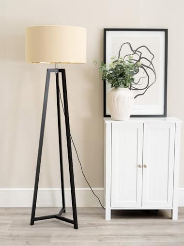 Black Tripod Floor Lamp with Beige and Gold Shade