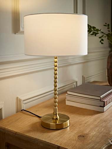 Maeve Brushed Gold Bobbin Table Lamp with White Fabric Shade