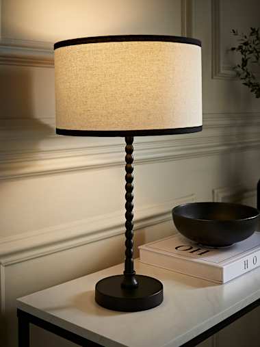 Maeve Black Bobbin Table Lamp with Black Trim Linen Shade